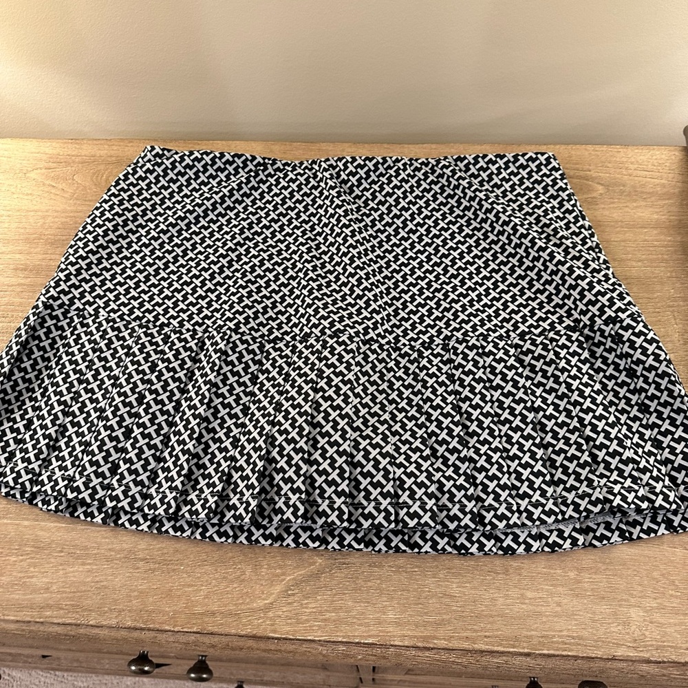 Great condition Tory Sport tennis skirt with cream shorts underneath. Navy.